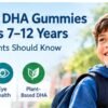 Gumzy DHA gummies for kids 7–12 years with a school-age child and icons for brain support, eye health and plant-based DHA